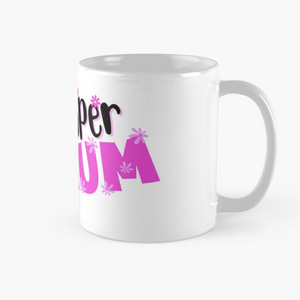White coffee mug with a super mum design showing "super mum" in bold pink and black and a mum with several arms holding multiple items signifying mum can do all the things