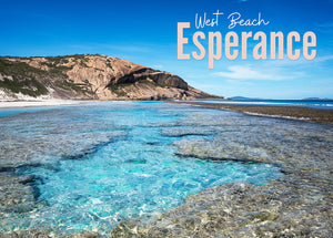 A photo of the image that is the 500 piece jigsaw puzzle,  it is a reef pool and a rocky headland with a blue sky on a sunny day.  