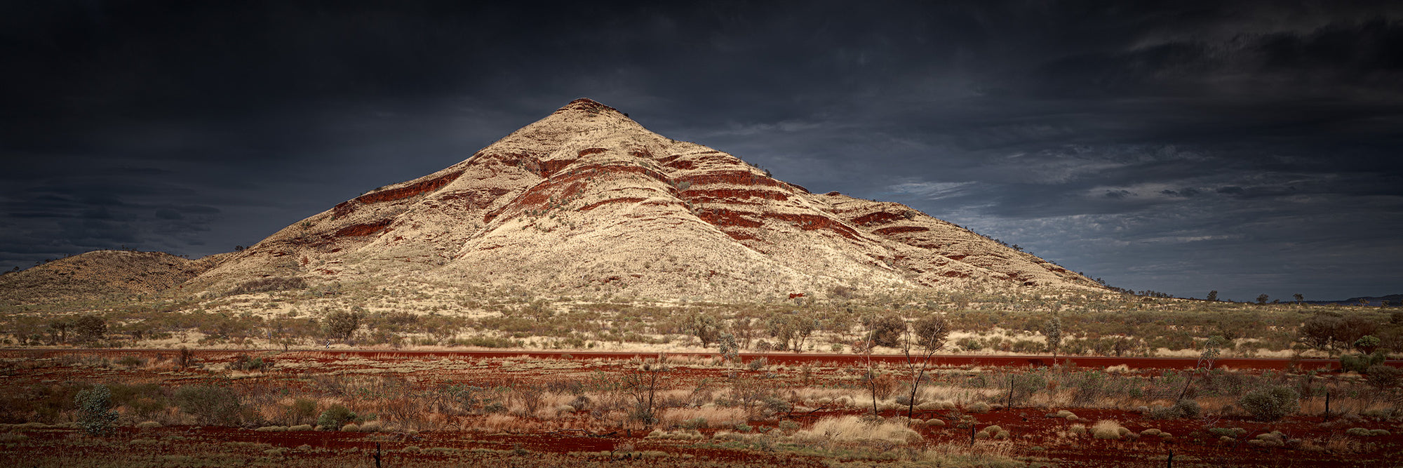 Mount Bruce summit in Karijini National Park Western Australia moody clouds panorama